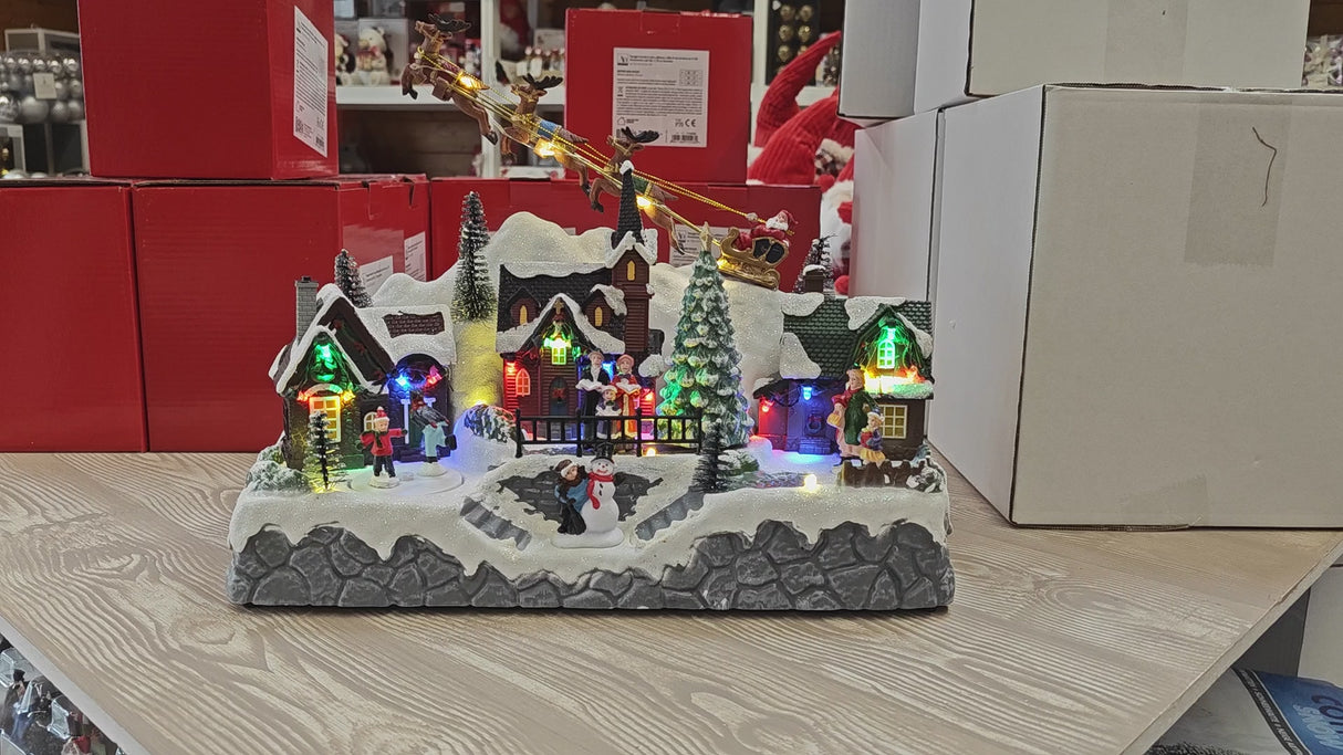 Paesaggio invernale Babbo Natale in slitta con 28 luci a led bianco caldo, musica e movimenti